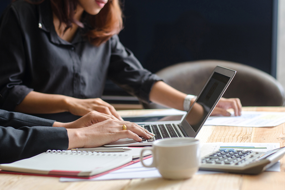 professional_women_working_laptop_close_up